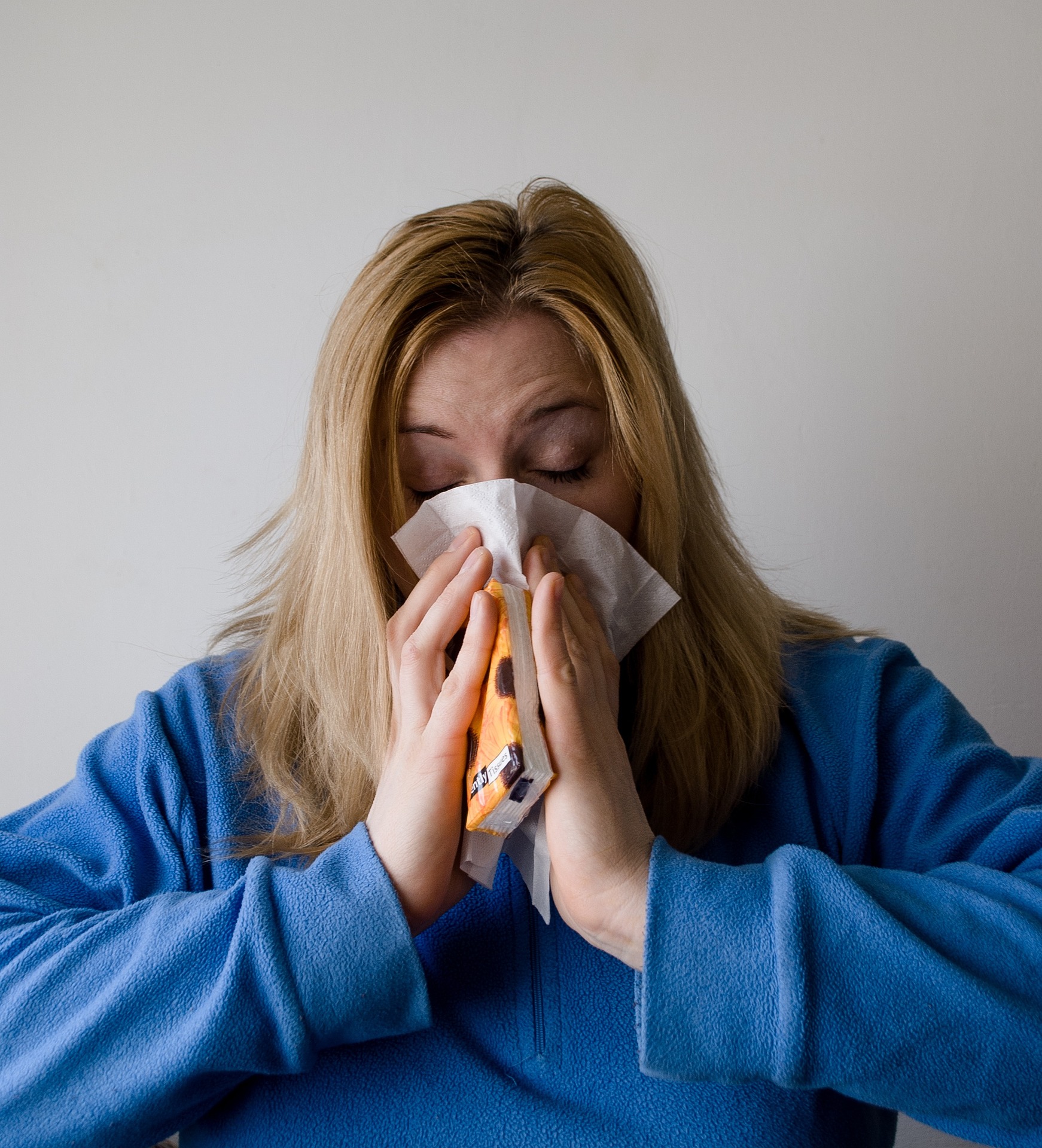 Sick Woman Blowing Nose