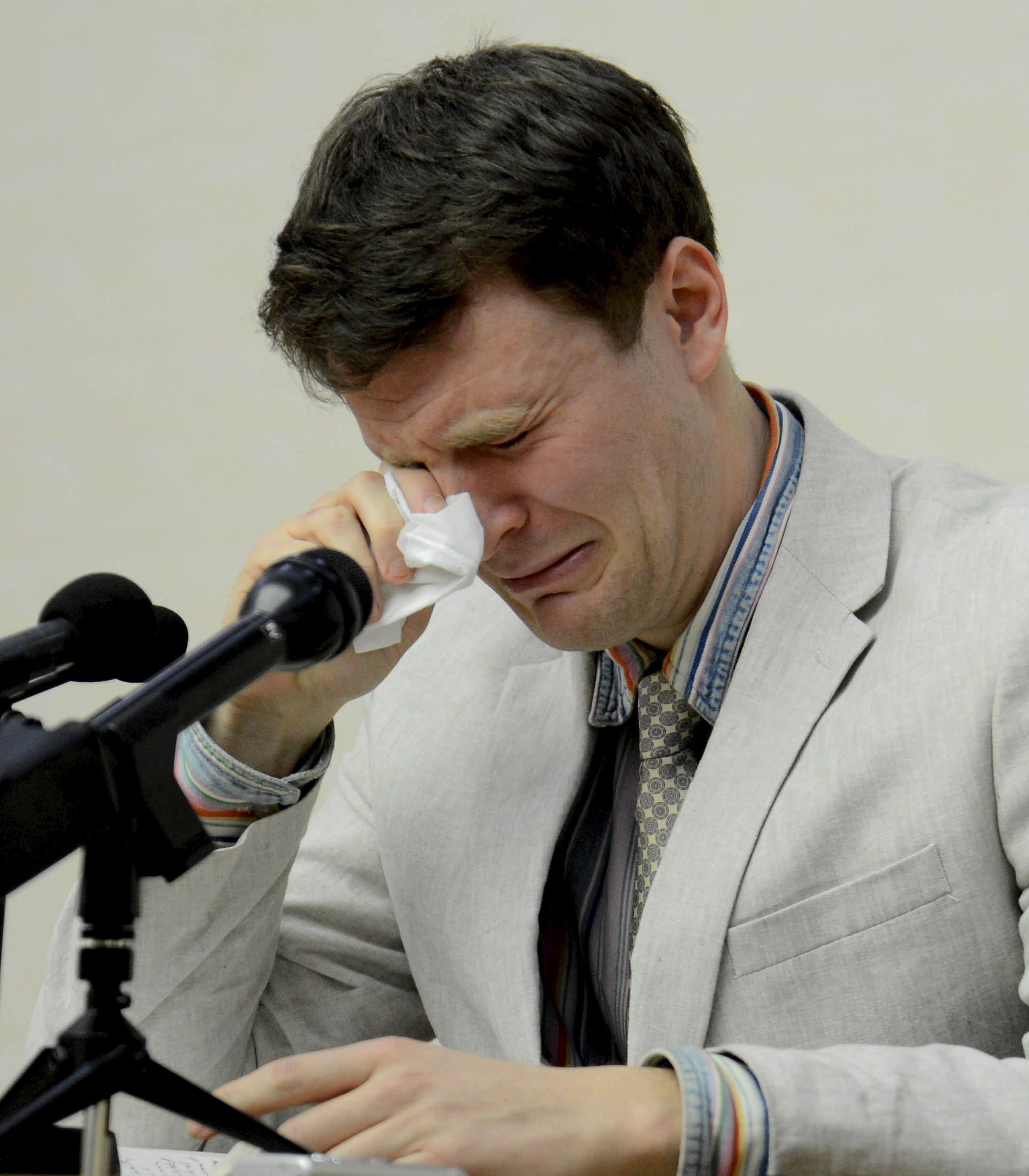 U.S. student Warmbier reacts at a news conference in this undated photo released by North Korea's Korean Central News Agency (KCNA) in Pyongyang